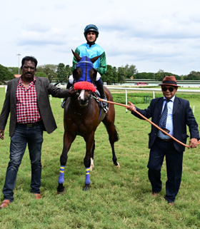 Sea Blush (S Saqlain up) winner of the Belur Plate, being led in by trainer Warren Singh on Thursday races at Mysore.